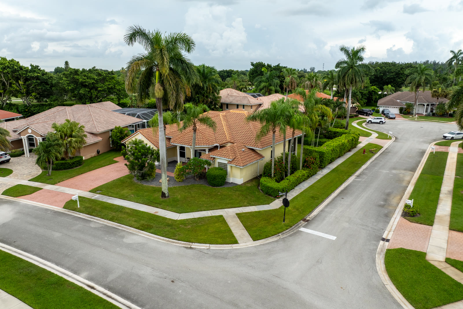 Aerial photograph of a Boca Raton home under an overcast gray sky before editing