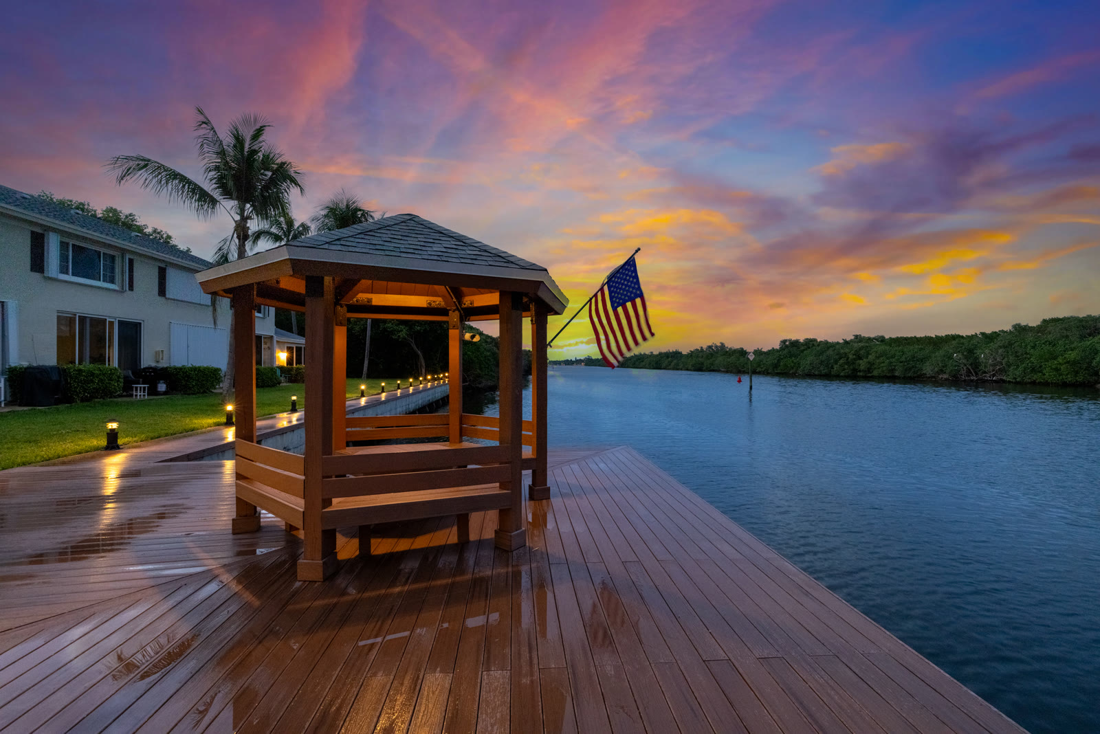 Private dock with American flag at twilight on the Intracoastal Waterway, shot by All Things Creative